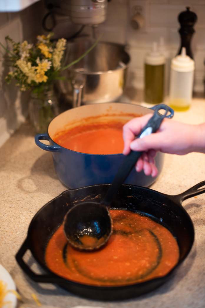 enchilada sauce in bottom pan