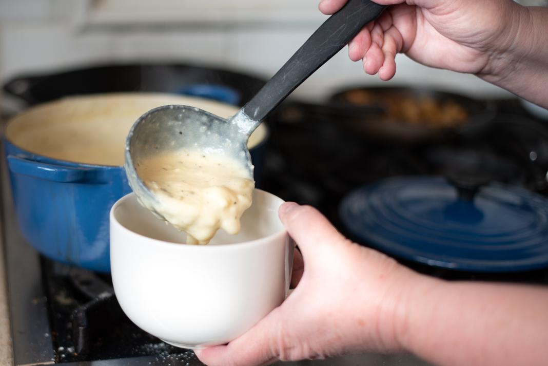 Ladling Cream of Potato Soup into bowl