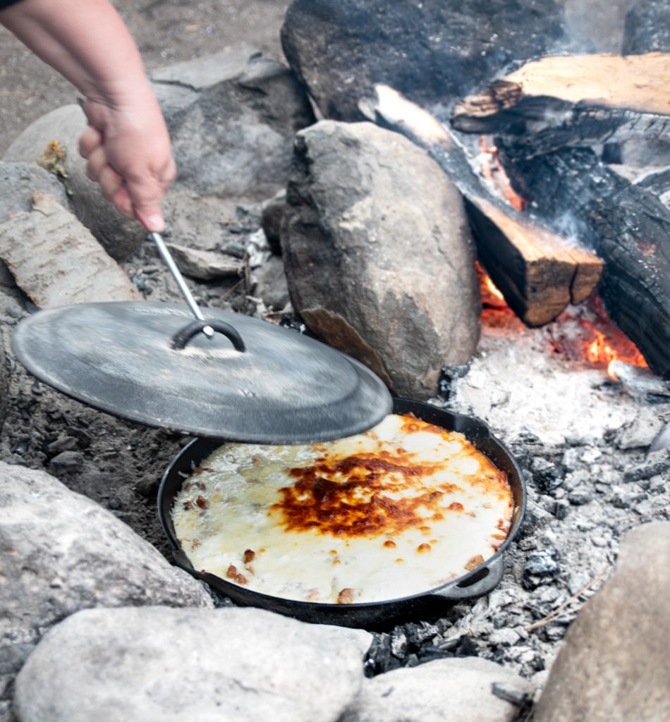 https://omadarling.com/wp-content/uploads/2019/06/Taking-lid-off-huge-Camp-Chef-Skillet-with-Lid-Lasagna-950x1024.jpg